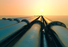 Several pipelines and a sun in the background