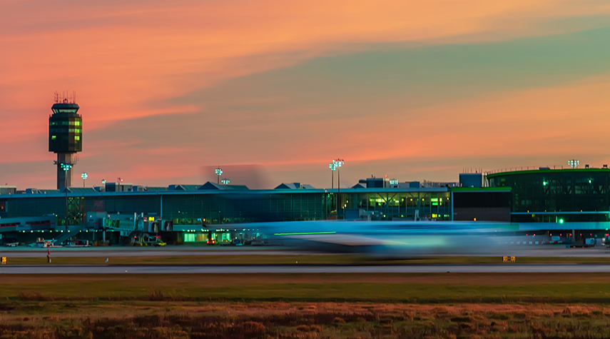 Airport runway with moving plane